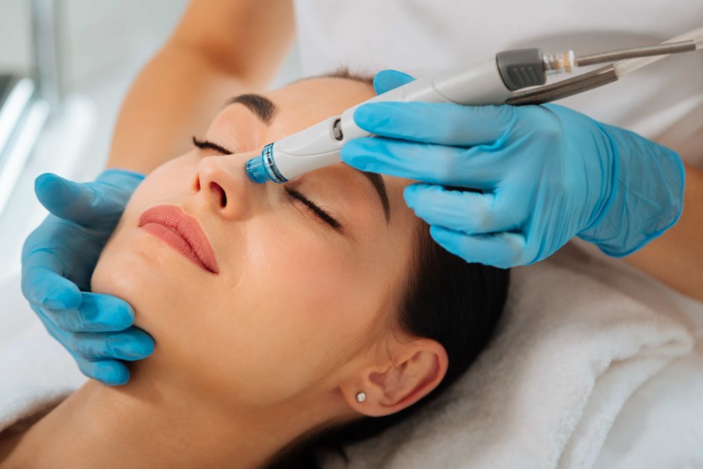 What is a Hydrafacial and How Does It Work? 2 A Woman receiving HydraFacial | Halina Spa in Round Rock & Austin, TX