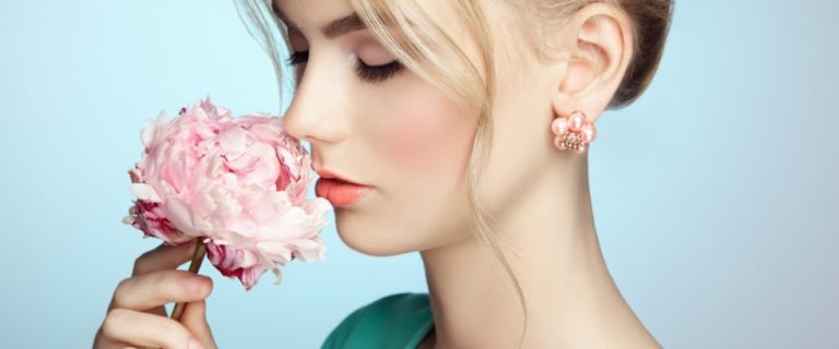 A Cute girl smelling flowers | Skin Detox | Halina Spa in Round Rock & Austin, TX